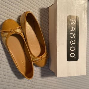 Now Accent toe cap woven straw ballet flats